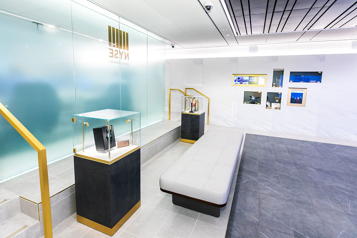 The entrance to the NYSE’s redesigned lobby featuring wall displays and freestanding exhibits.