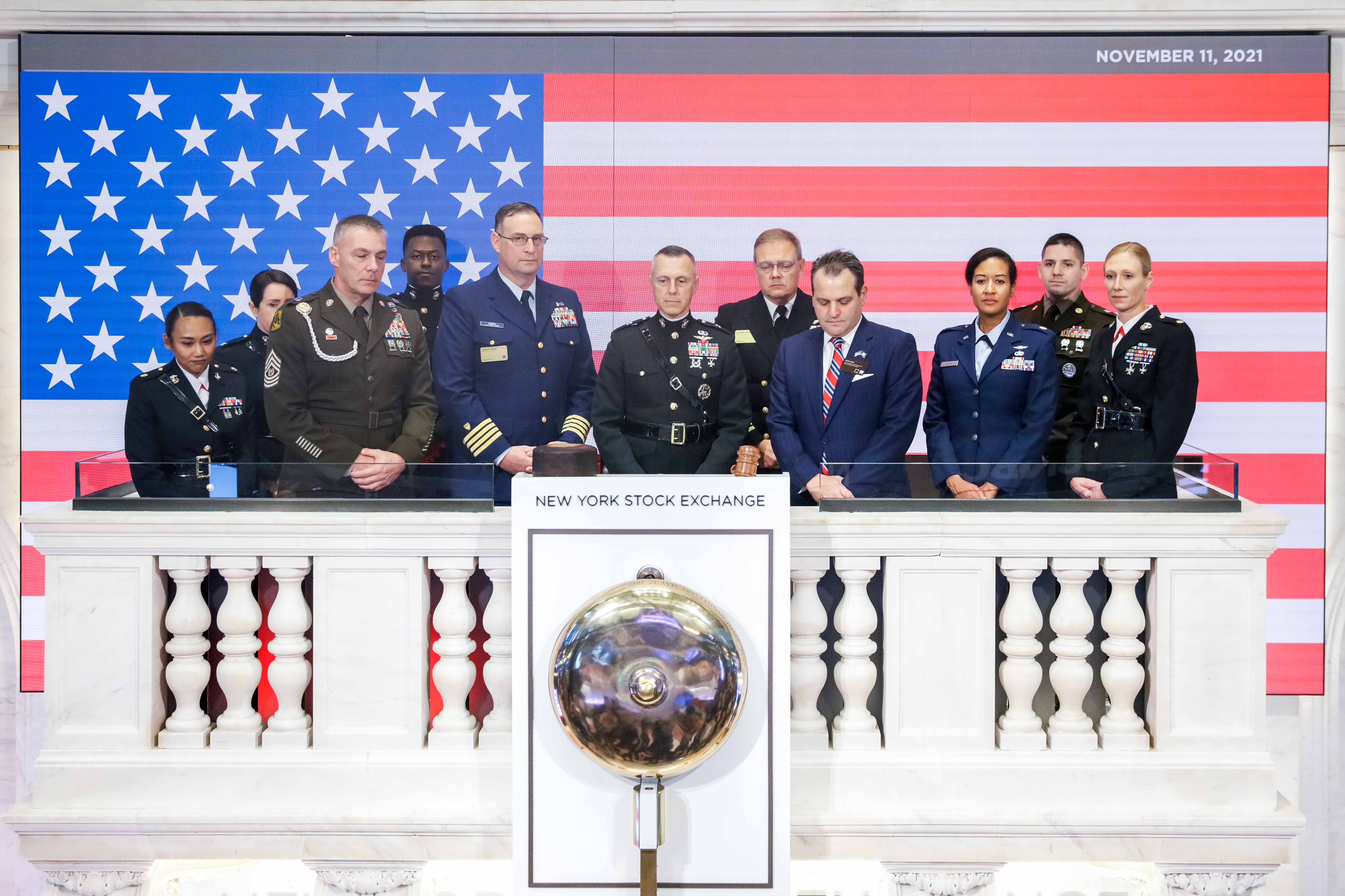 Members of the military participate in the Veterans Day moment of silence.