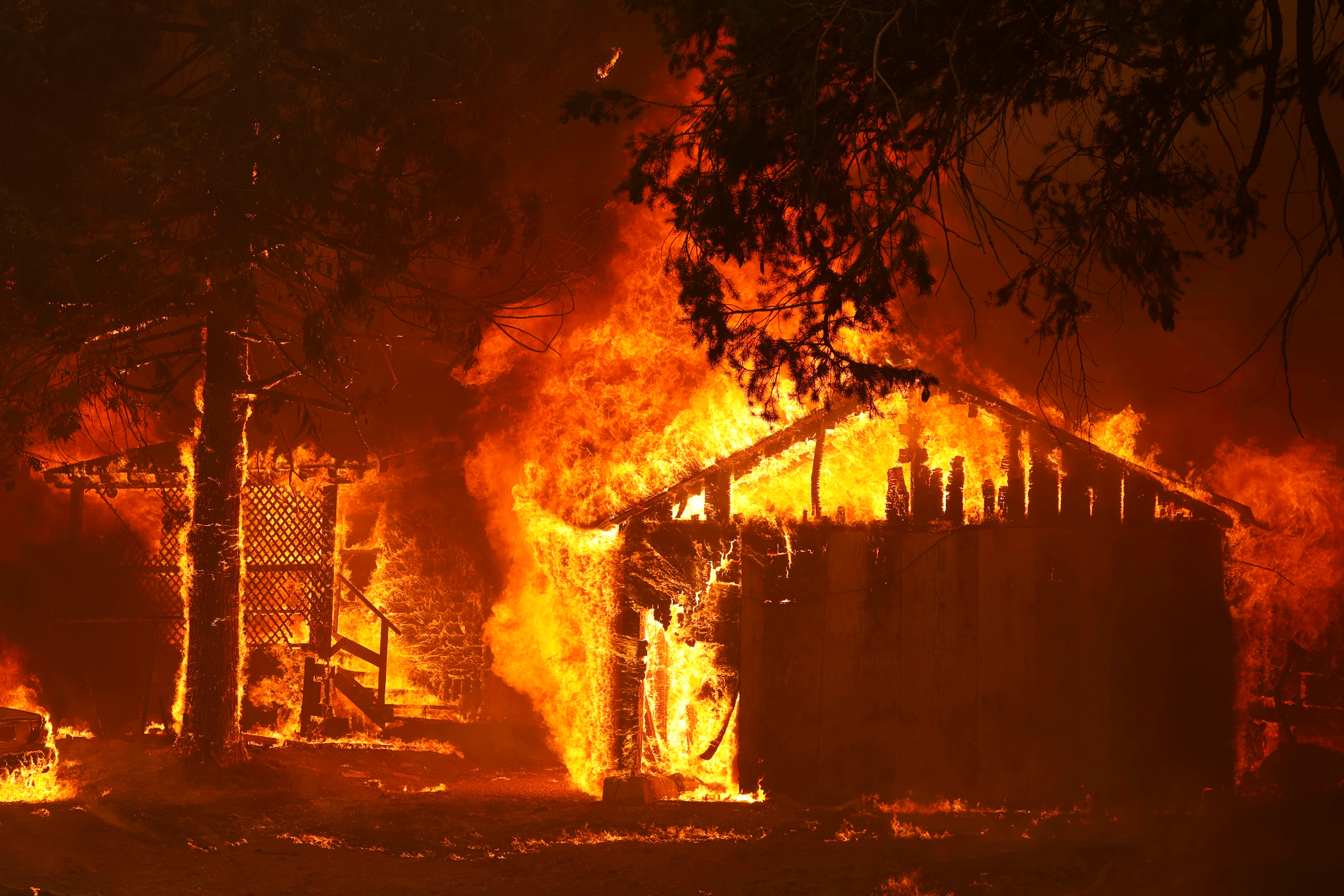A house in flames at the Dixie Fire near Greenville, Calif. Reuters/Fred Greaves
